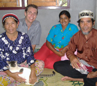 Doug realxing with host family in Ban Talae Nok