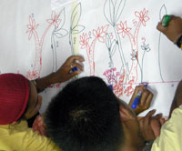 Youths plot their transect maps according to the measurements previously taken.