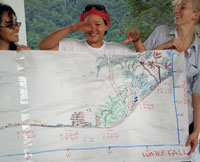 UCLA students showing their participatory community mapping results to the Ban Talae Nok students.