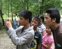 Khammany assisting the Naka Wildlife Sanctuary Youth Group on a nature trail.