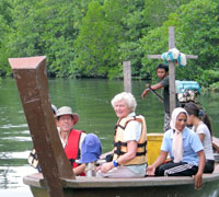 Take the helm of a tradional longtail!