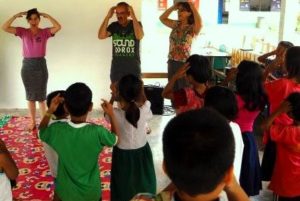 volunteers in thailand dance with Thai students